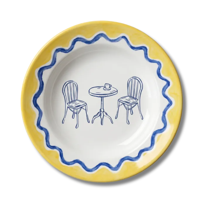 Hand-painted plate with a bistro table and chairs